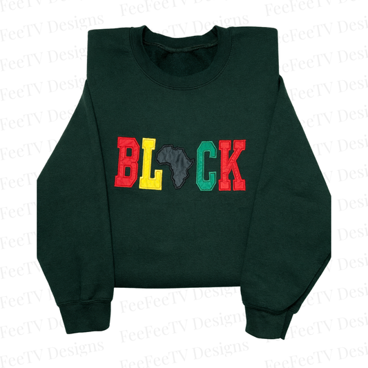 BLACK appliqué embroidered sweatshirt with colorful lettering and Africa silhouette on green crewneck