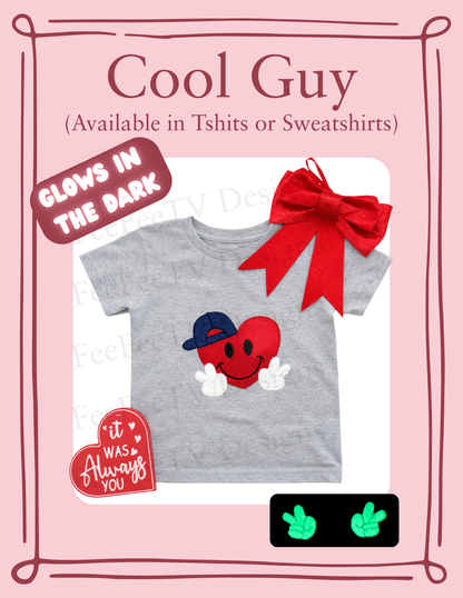 Gray t-shirt with red heart design and text, featuring a red bow on a pink background.
